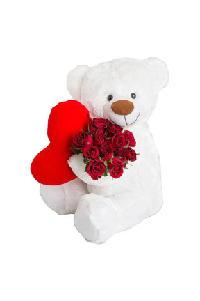 Romantic red rose bouquet with soft teddy bear.