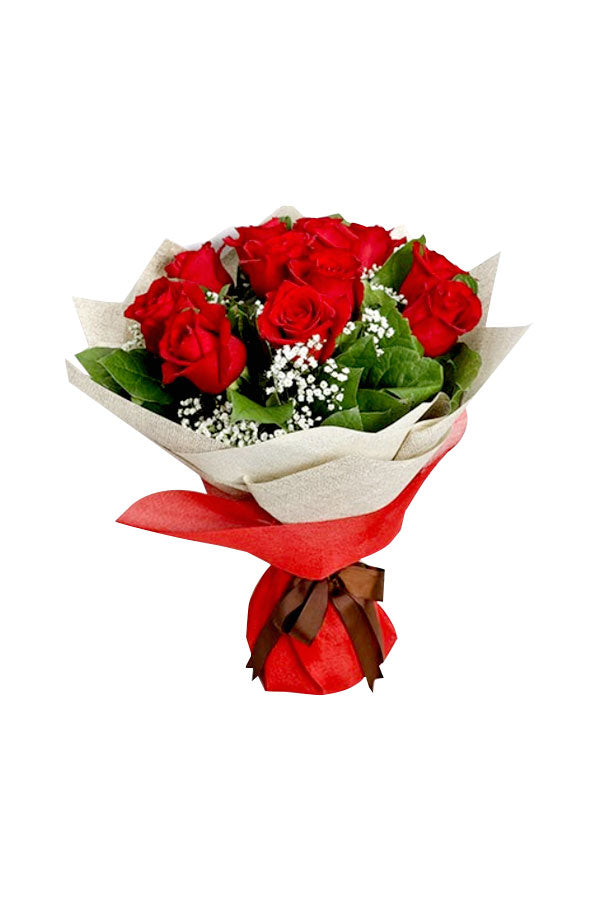Hand-tied red rose bouquet wrapped in decorative white cellophane