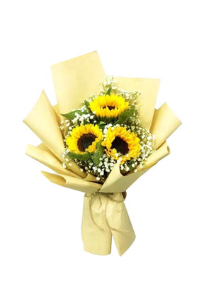 Fresh yellow sunflowers in a decorative flower bouquet