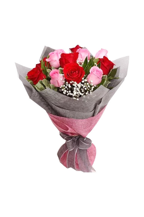 Elegant floral bunch featuring red and pink roses with fillers