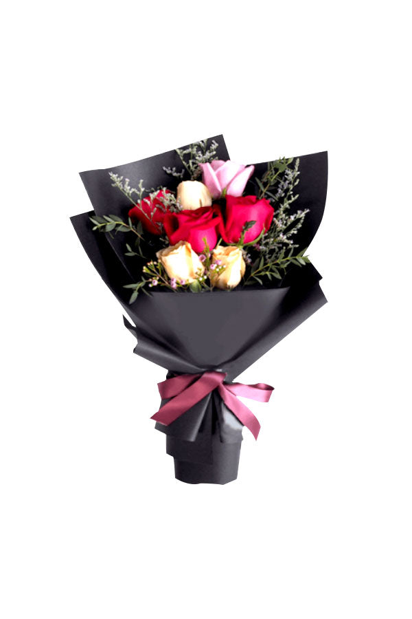 Fresh mixed roses including red, yellow, and pink blooms