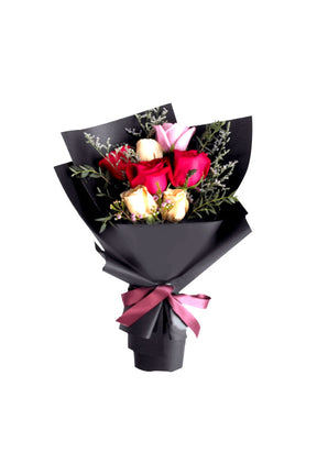 Fresh mixed roses including red, yellow, and pink blooms