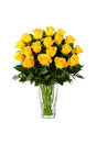 Bouquet of 18 yellow roses arranged in a decorative glass vase